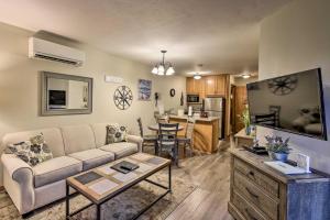 
a living room filled with furniture and a kitchen at Condo with Resort Amenities - 1 Mile to Beach and Golf in Egg Harbor
