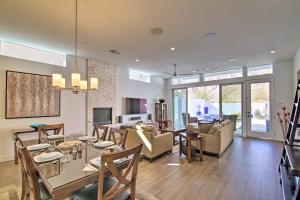 a dining room and living room with a table and chairs at 'Desert Pearl' Oasis with Private Pool - Lower Rates in La Quinta