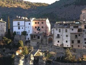 a group of buildings on top of a mountain at Hostal Tabanqueta in Cuenca