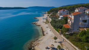 an aerial view of a beach next to the water at Apartments Marko in Trogir