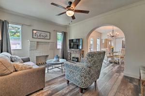 a living room with a couch and a chair at Spacious Winter Garden Home with BBQ, Walk to Dwtn! in Orlando