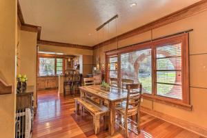 a kitchen and dining room with a wooden table and chairs at North End Boise Home with Courtyard about 3 Mi to Dtwn! in Boise
