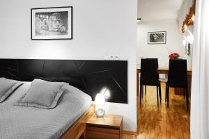 Posteľ alebo postele v izbe v ubytovaní Krakow For You Main Square Apartments