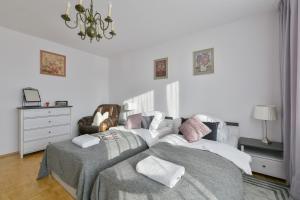 Posteľ alebo postele v izbe v ubytovaní Medicover Wilanow P&O Serviced Apartments