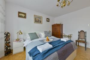 Posteľ alebo postele v izbe v ubytovaní Medicover Wilanow P&O Serviced Apartments