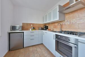 Kuchyňa alebo kuchynka v ubytovaní Medicover Wilanow P&O Serviced Apartments