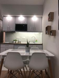 A kitchen or kitchenette at Lakones Deluxe Suites A