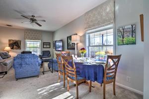 a dining room and living room with a table and chairs at Family Farmhouse on 160-Acre Ranch with Hiking Trail in Lawrenceburg