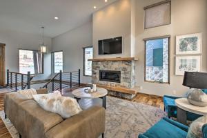 a living room with a couch and a fireplace at Modern Mountain-View Townhome Less Than 7 Mi to Ski Resorts in Eden