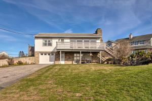 een groot wit huis met een balkon en een oprit bij Rhode Island Oceanview Retreat Walk to Shore! in Narragansett