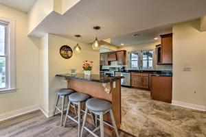 a kitchen with a bar with stools in it at Seaside Wildwood Haven Walk to BoardwalkandBeach! in Wildwood Crest