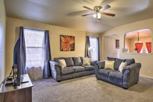 a living room with two couches and a flat screen tv at San Antonio Abode with Yard Less Than 4 Mi to Lackland in San Antonio