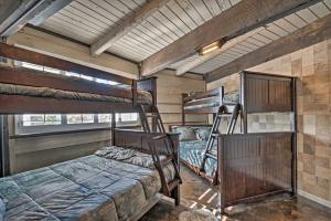 a room with two bunk beds and two windows at Sierra Blanca Mountain Retreat 16 Miles to Ruidoso in Nogal