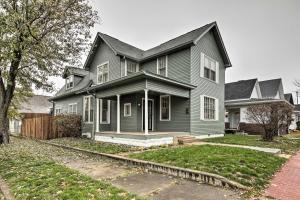 a gray house with a porch and a yard at Historic Noblesville Home Walk to Downtown Shops! in Noblesville