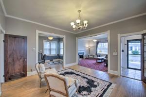 a living room with a couch and a table at Historic Noblesville Home Walk to Downtown Shops! in Noblesville