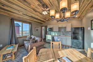 a living room with a table and a kitchen at Romantic Mountain Getaway - 1 Hour to Yellowstone! in Livingston