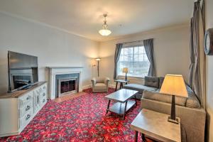a living room with a couch and a fireplace at Historic Noblesville Home Walk to Downtown Shops! in Noblesville
