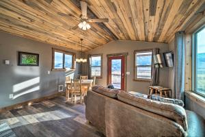 a living room with a couch and a table at Romantic Mountain Getaway - 1 Hour to Yellowstone! in Livingston