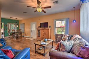 a living room with a couch and a ceiling fan at Restful Mesa Retreat Shared Backyard and Hot Tub in Mesa