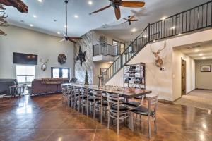 a large dining room with a table and chairs at Kansas Hunting Lodge Pets and Large Groups Welcome! in Great Bend