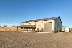 a large metal building with a large garage at Kansas Hunting Lodge Pets and Large Groups Welcome! in Great Bend