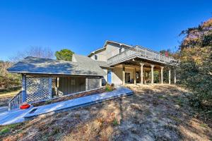 a large house with a porch and a deck at Bright Southern Shores Family Home Less Than 1 Mi to Beach in Southern Shores