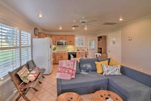 a living room with a couch and a refrigerator at Casa de Samuel - Patio, Fountain and Outdoor Kitchen in Corpus Christi