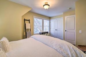 a bedroom with a white bed and a window at River Street Roost - 12 Miles to Sun Valley Resort in Hailey