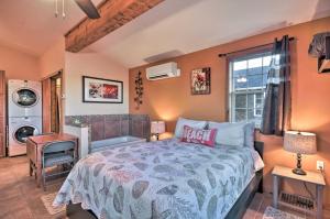 a bedroom with a bed and a washing machine at Cute Studio Abode - Steps to Long Beach Boardwalk! in Long Beach