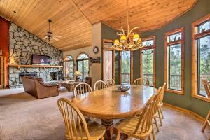 a dining room with a wooden table and chairs at Year-Round Big Bear Mtn Lodge - Hike, Ski, Fish! in Big Bear Lake