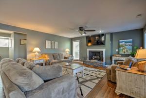 a living room with two couches and a fireplace at Bayview Lake House with Dock on Lake of the Ozarks in Lake Ozark