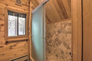 a bathroom with a shower stall and a window at 2 Mi to Northstar Resort Idyllic Cabin with Shuttle in Truckee +27 photos