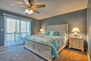 a bedroom with a bed and a ceiling fan at Bayview Lake House with Dock on Lake of the Ozarks in Lake Ozark