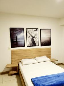 Postel nebo postele na pokoji v ubytování HOTEL MEDELLIN CENTRAL