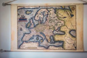 an old map of europe on a wall at Da Alessia Per Dormire Al Coppedé in Rome