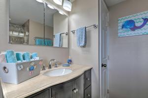 a bathroom with a sink and a mirror at Canalfront Home with Dock and Access to Gulf of Mexico in Hudson +16 photos
