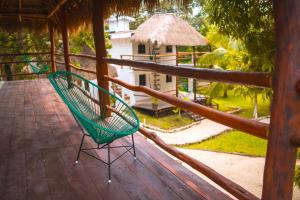 Balkón nebo terasa v ubytování Royal Palm Bacalar Cabañas & Lagoon Club