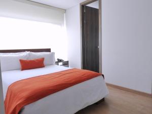 Postel nebo postele na pokoji v ubytování Hotel Portal de los Andes