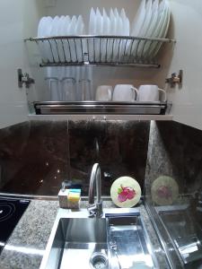 a kitchen counter with a sink and a sink at New Gudauri loft1 in Gudauri