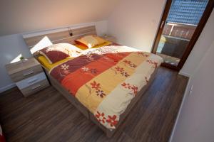 A bed or beds in a room at Apartment Jezero Lake Bohinj