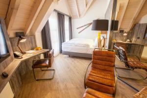 Televiisor ja/või meelelahutuskeskus majutusasutuses Boutiquehotel Thessoni Classic & Self service Residence Home Zürich