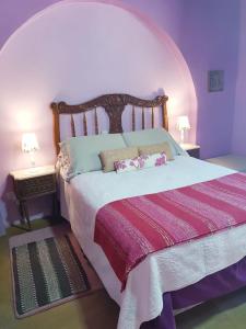 En eller flere senger på et rom på Posada El Cortijo