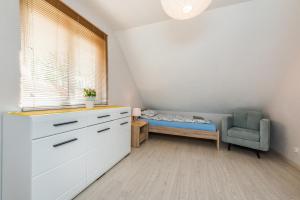 Posteľ alebo postele v izbe v ubytovaní Dom Kaszubski nr 65