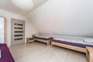Posteľ alebo postele v izbe v ubytovaní Dom Kaszubski nr 65