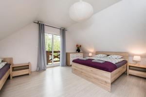 Posteľ alebo postele v izbe v ubytovaní Dom Kaszubski nr 65