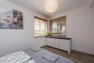Posteľ alebo postele v izbe v ubytovaní Dom Kaszubski nr 65