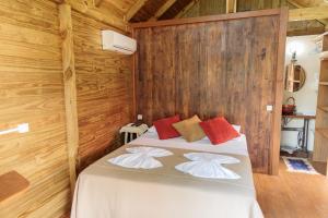 Postel nebo postele na pokoji v ubytování Pousada Homestay Jaraguá Do Sul