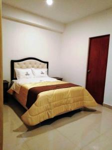 Giường trong phòng chung tại Hotel Ocean Beach Paracas