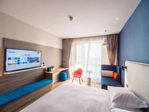 Ένα ή περισσότερα κρεβάτια σε δωμάτιο στο Holiday Inn Express Kunming West, an IHG Hotel