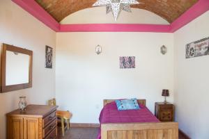 a bedroom with a bed and a star on the ceiling at Lofts Las Cuatro Puertas in Guanajuato